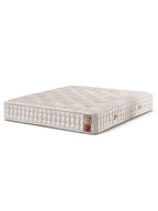 Eine luxuriöse Matratze mit einem Etikett, das auf Rosshaar und Premium-Qualität hinweist. Sie ist hellbeige und hat ein gestepptes Muster.