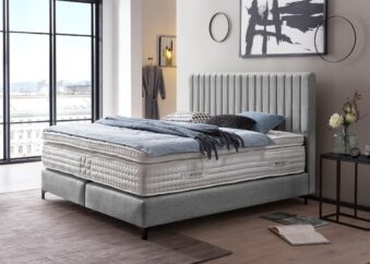 Boxspringbett Paris modernes Kopfteil mit vertikalen Linien in Webstoff Hellgrau
